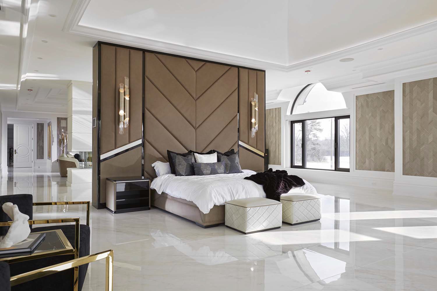 Custom principal bedroom suite with upholstered millwork wall — Basal Master Builds